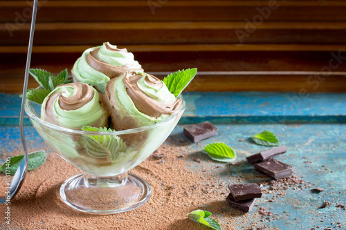 Delicious ice cream with mint and chocolate in the cup of glass