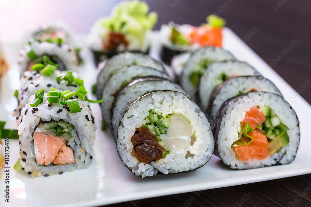 Sushi set with chopsticks on the plate Sushi set with chopsticks on the plate