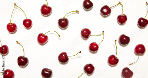 Fresh cherries pattern on the white background. Top view