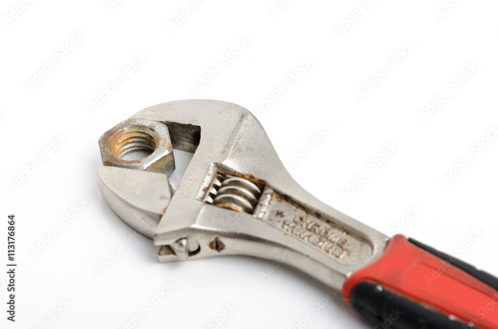 French key wrench and rusted nut isolated on white background French key wrench and rusted nut isolated on white background