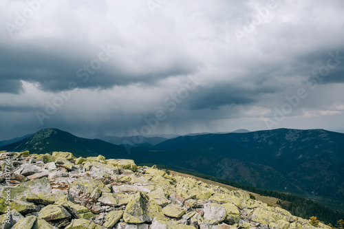 thunderstorm in mountains. dark clouds photo