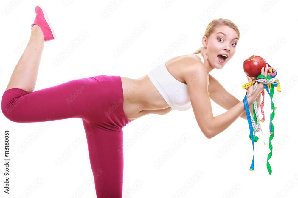 Funny woman holding apple and tape measures. Funny woman holding apple and tape measures.