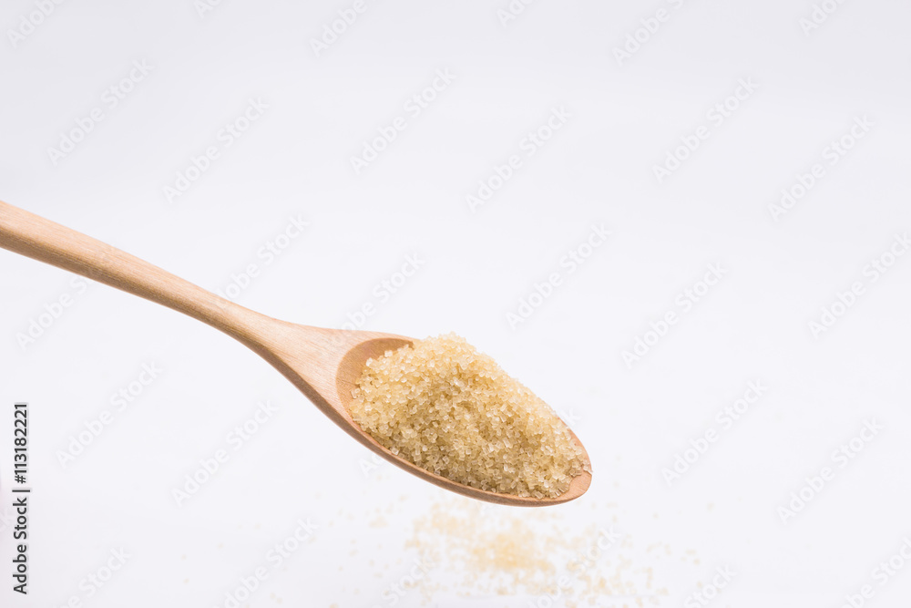 Close up brown Sugar in spoon on sugarcane blur background Close up brown Sugar in spoon on sugarcane blur background