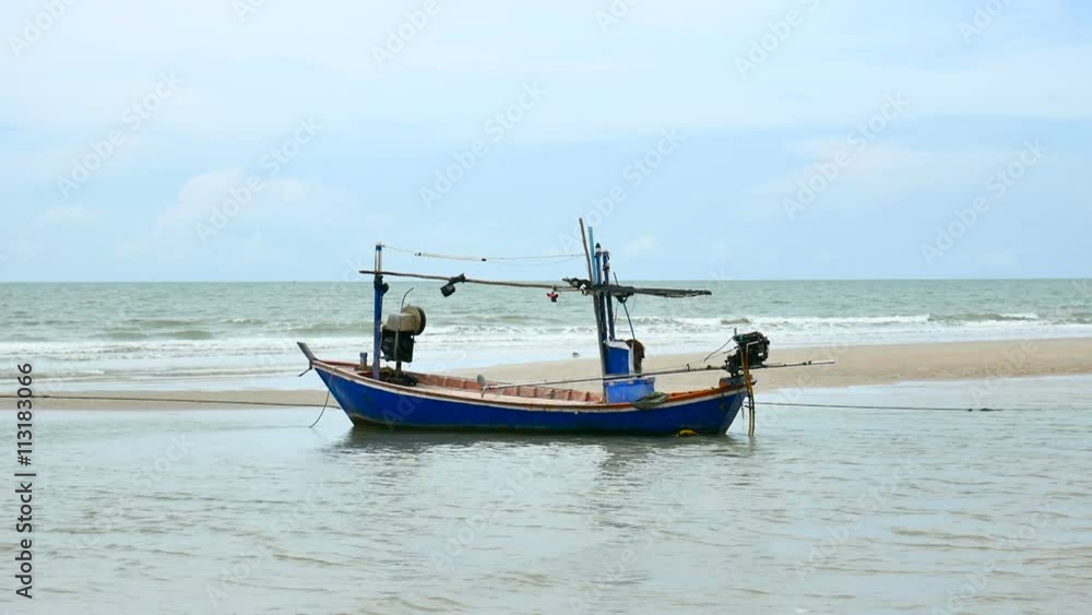 local fisherman boat moor at the beach when Low tide time cha-am thailand local fisherman boat moor at the beach when Low tide time cha-am thailand
