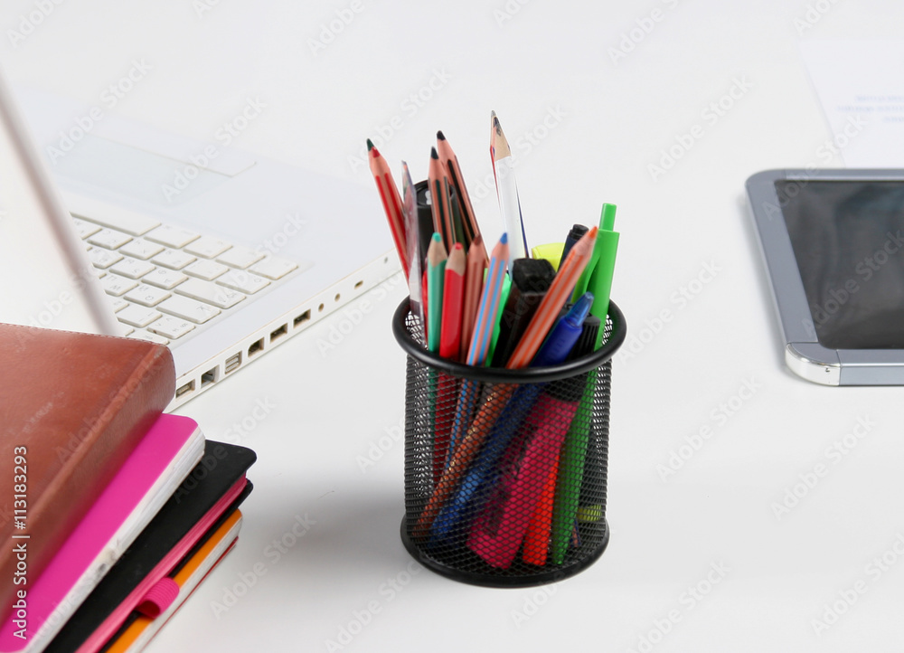 Fototapeta premium Stack of books and stationery isolated on white background