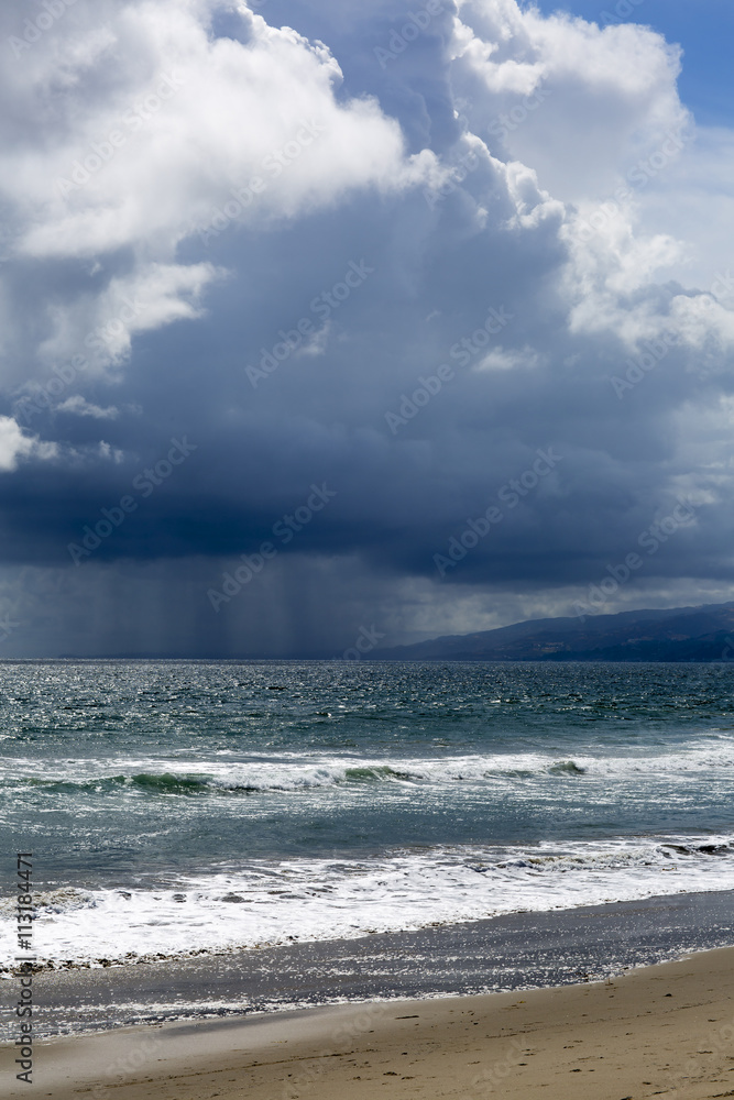 Pacific ocean during a storm. Beach landscape in the U.S. in bad weather. The ocean and waves during strong winds in United States, Santa Monica.