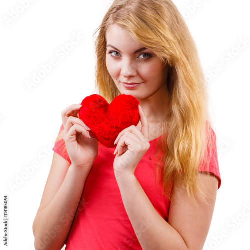 Woman blonde girl holding red heart love symbol © Voyagerix