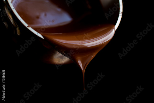Pouring melted chocolate photo