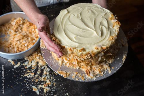 Covering coconut layer cake