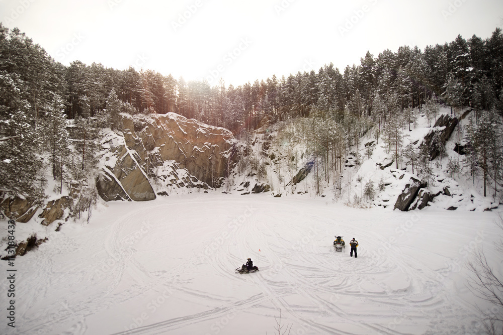Two men snowmobiling Two men snowmobiling