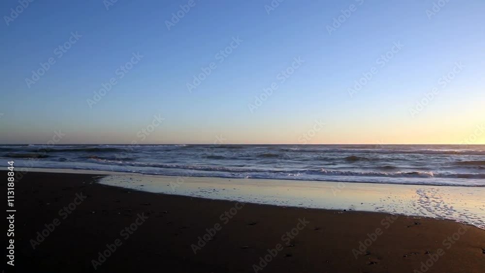 Empty Red Sand Beach With Waves And Blue Sky
Empty Red Sand Beach With Waves And Blue Sky