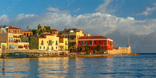 Picturesque panoramic view of old harbour, Firkas Fortress and Venetian quay of Chania in the morning, Crete, Greece © Kavalenkava
