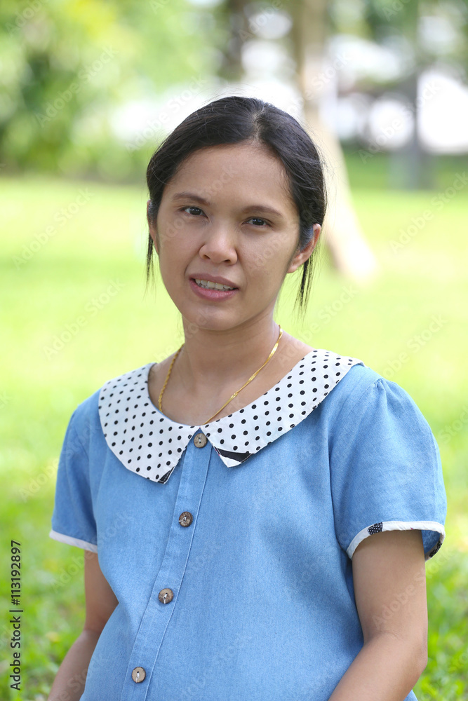 Asian pregnant woman is leisure in the public park. Asian pregnant woman is leisure in the public park.