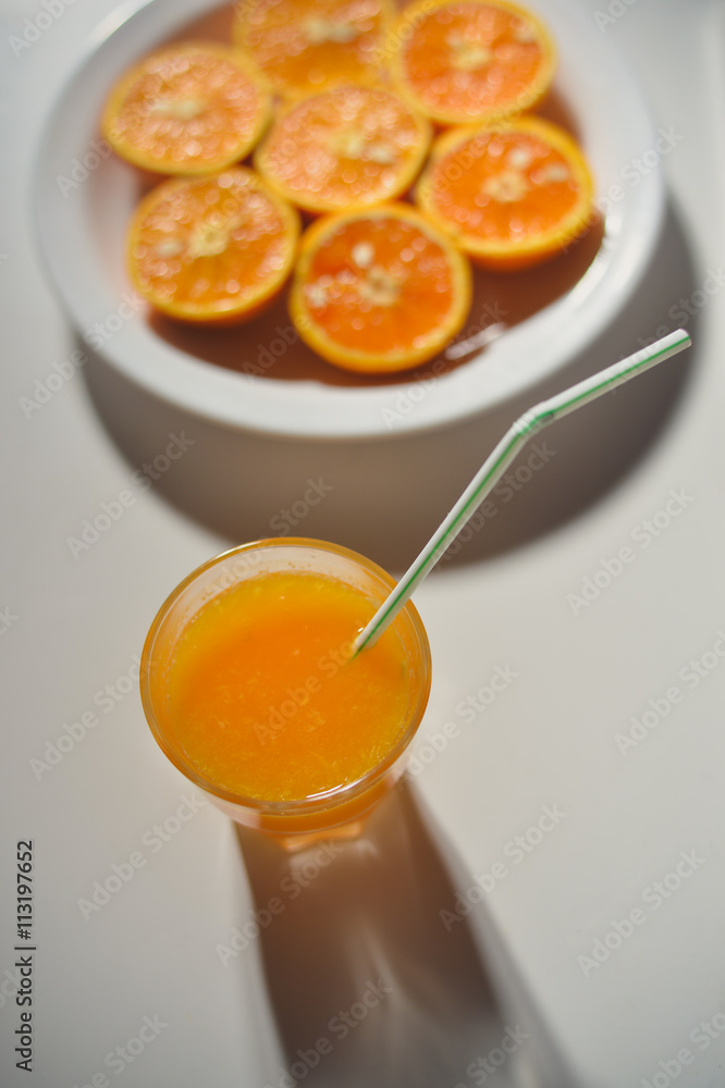 Top view of fresh sliced orange close-up on plate Top view of fresh sliced orange close-up on plate