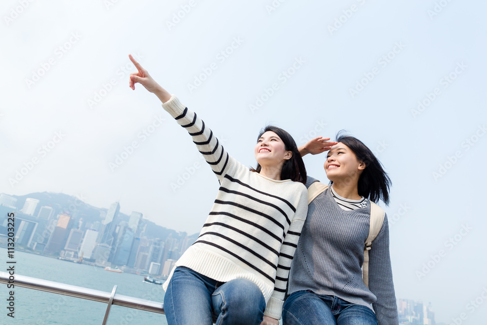 Two women looking for destination with travel in Hong Kong