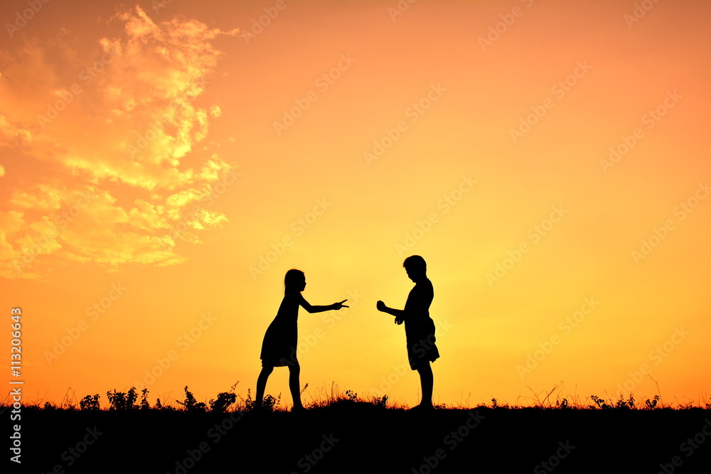 Silhouette children playing rock paper scisors Silhouette children playing rock paper scisors