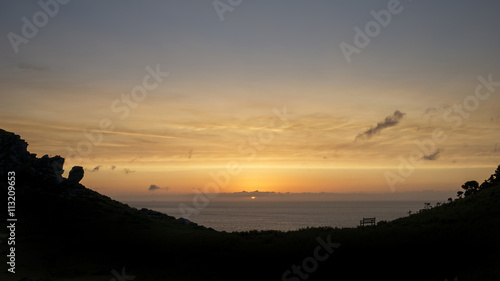 Silhouette landscape image of Valley Of The Rocks in Devon at su