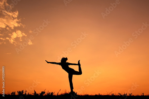 Silhouette women yoga at sky sunset © sawitreelyaon