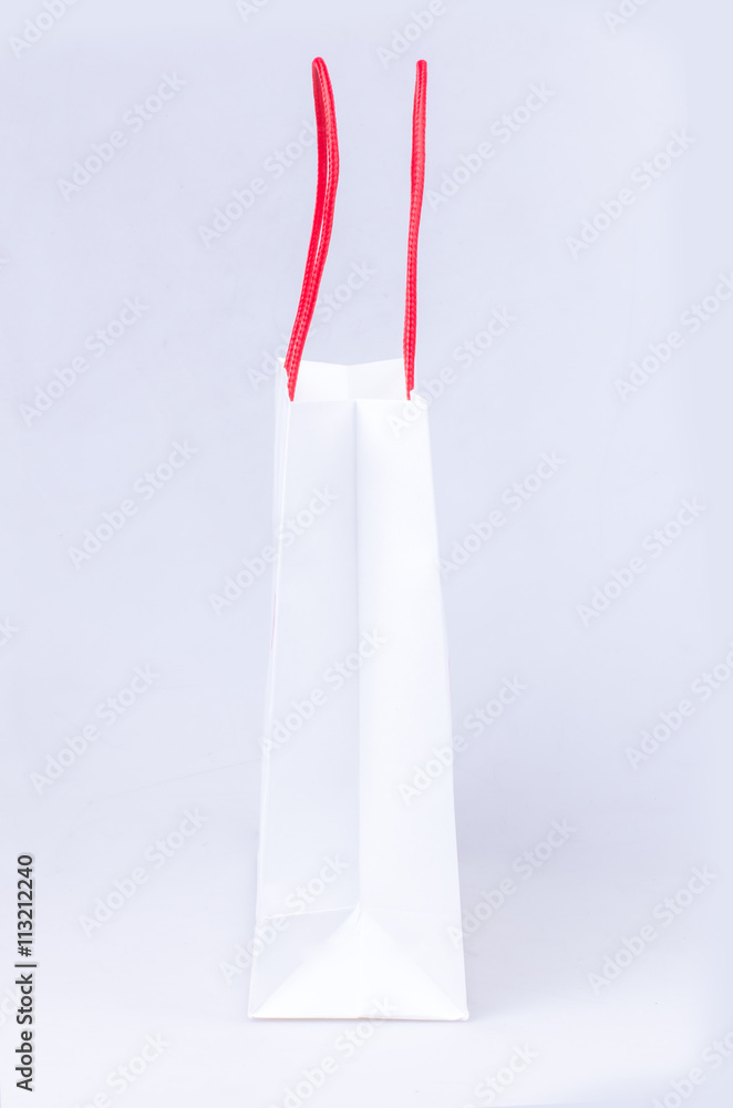 elegant white paper shopping bag with red handle elegant white paper shopping bag with red handle