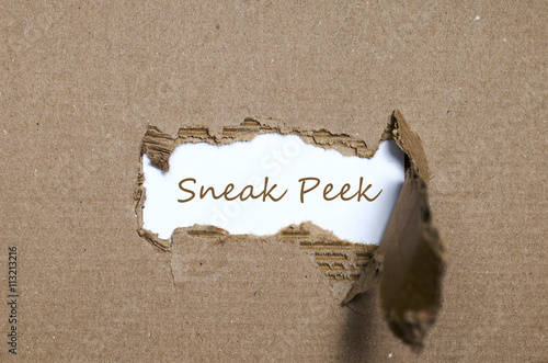 Photography The word sneak peek appearing behind torn paper.