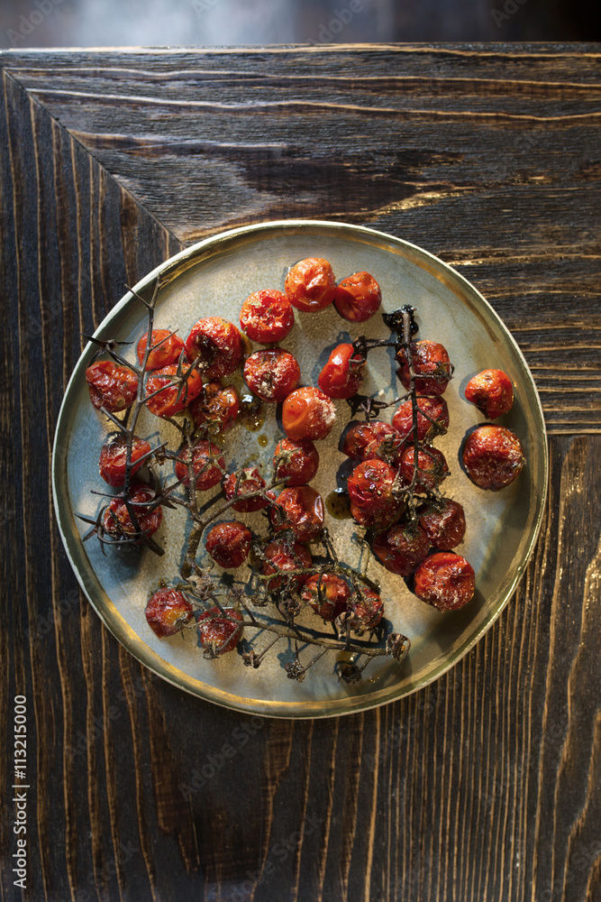 Overhead view of baked cherry tomatoes Overhead view of baked cherry tomatoes