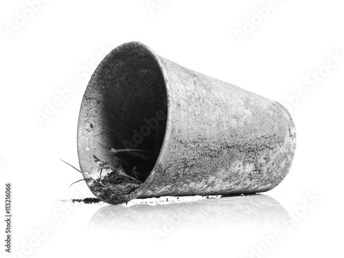 Old metal decaying bucket against white background