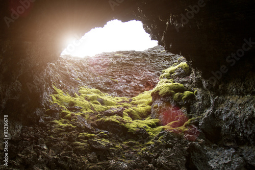 Low angle view of sunlight emitting on rock formation