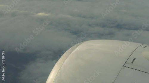 traveling by air. View through airplane window. Flight abobe spectacluar clouds. 4k photo