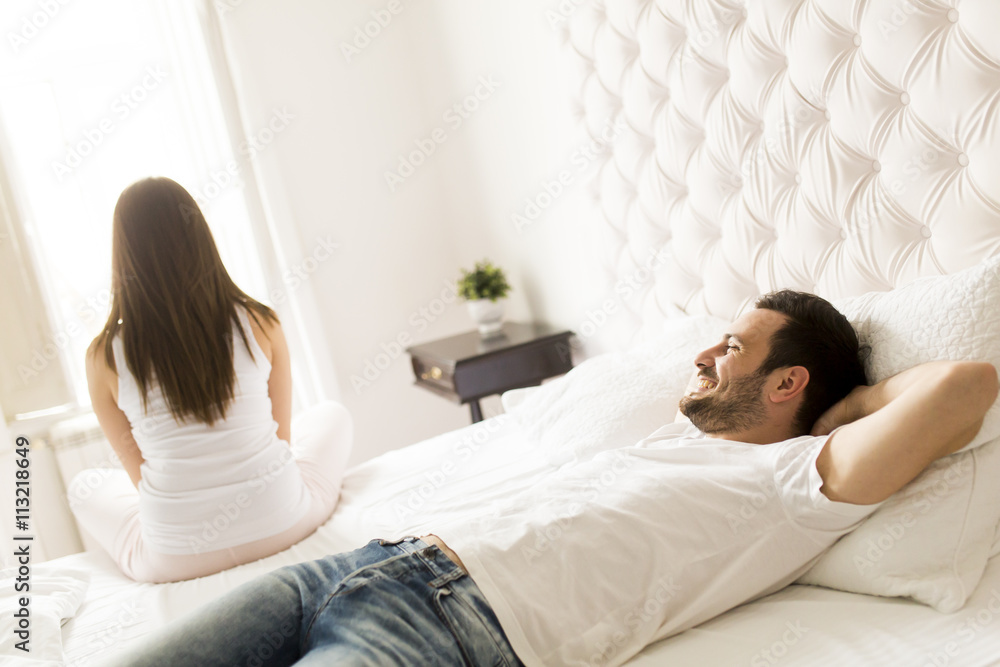 Young loving couple in the bed Young loving couple in the bed