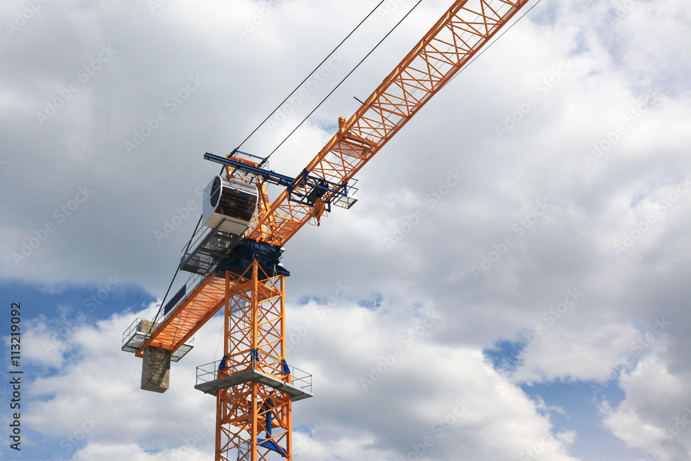 Orange Crane In Front Of Sky and Clouds Orange Crane In Front Of Sky and Clouds
