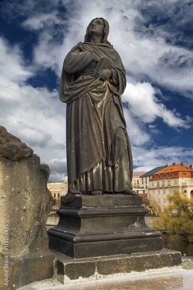 Statue of Jesus Christ on the Cross on Charles Bridge in Prague