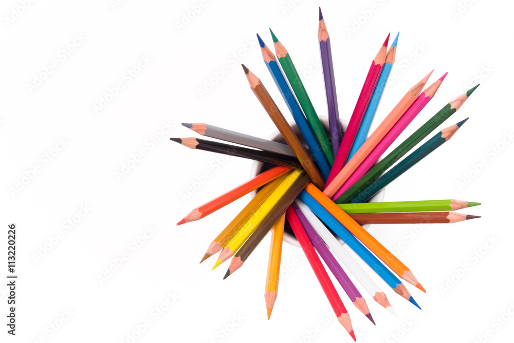 Colored pencils in cup on white background Colored pencils in cup on white background