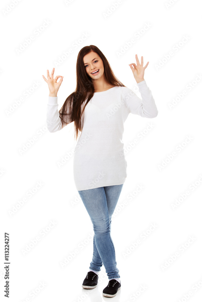 Young beautiful woman showing OK sign Young beautiful woman showing OK sign