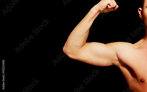 Biceps muscle of a young athletic man