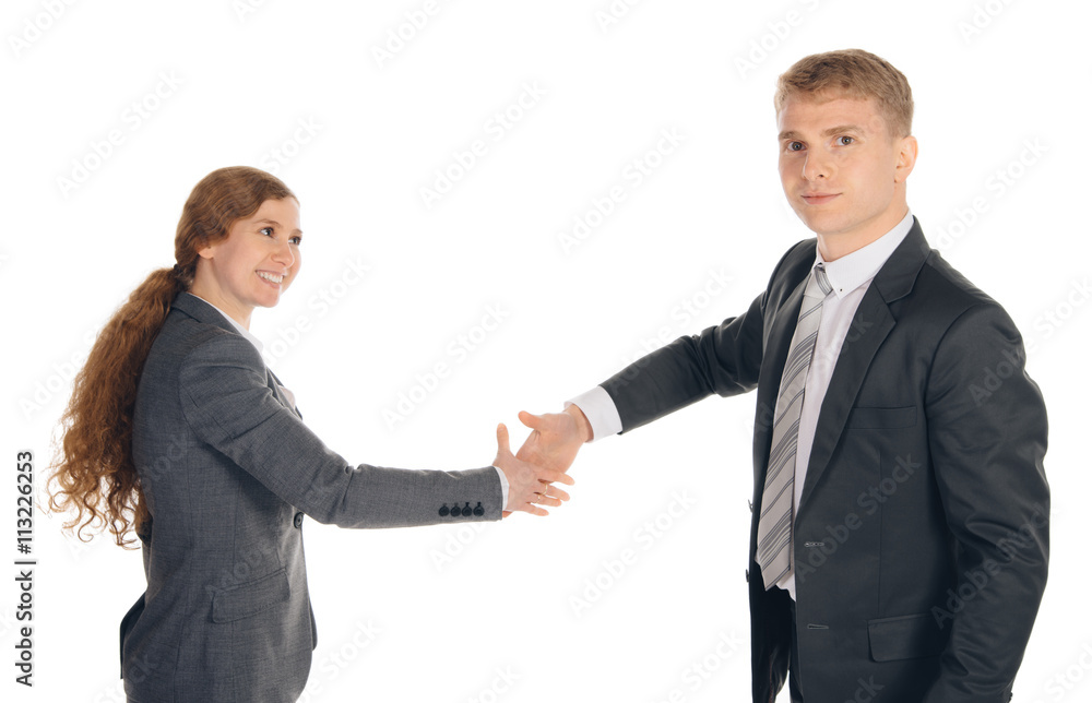two persons in suits given hands