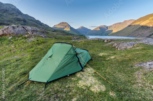 Tourist tent with view of Lake District mountains in background.