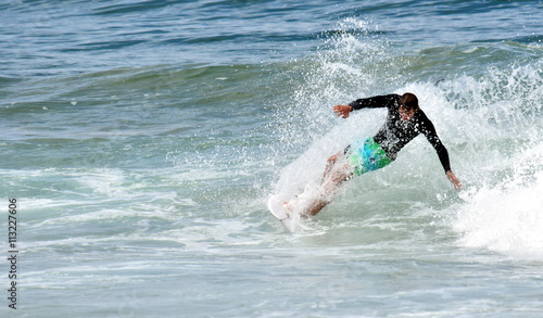 Amateur surfer on the beach