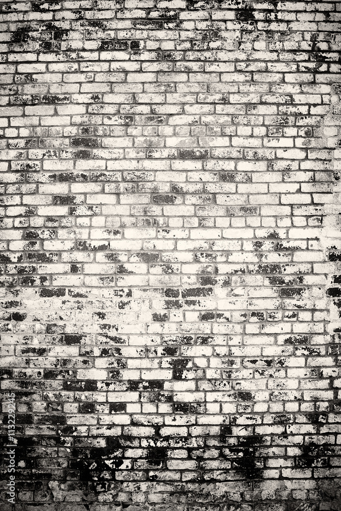 Black and white of old vintage brick wall with vignetted corners