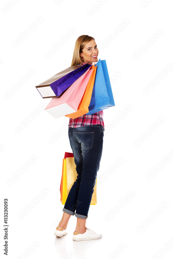 Young smiling woman holding shopping bags Young smiling woman holding shopping bags