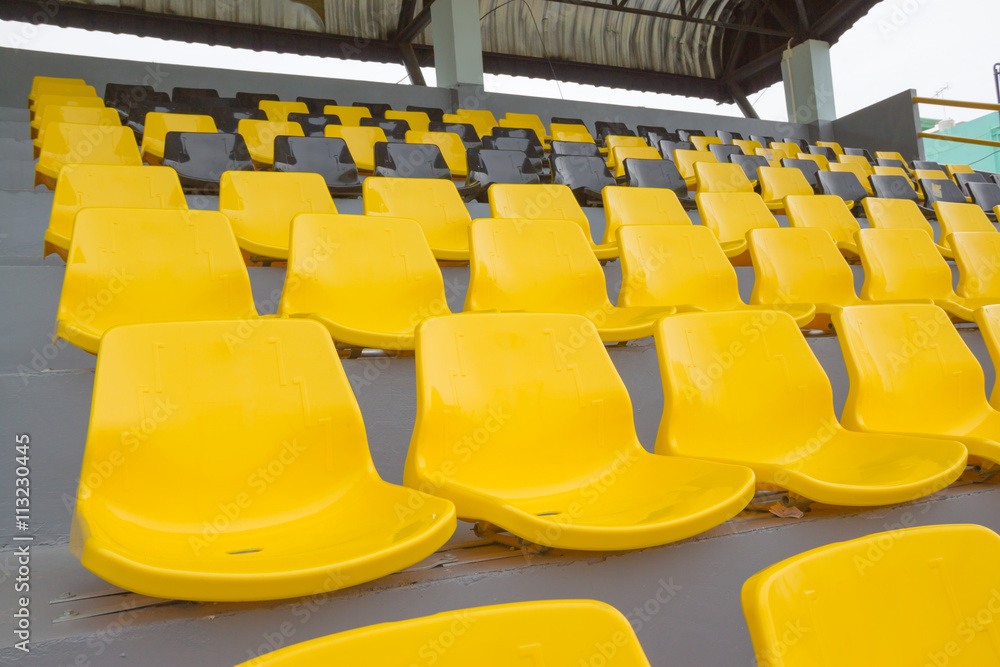 Fototapeta premium empty chairs and walkway in football stadium