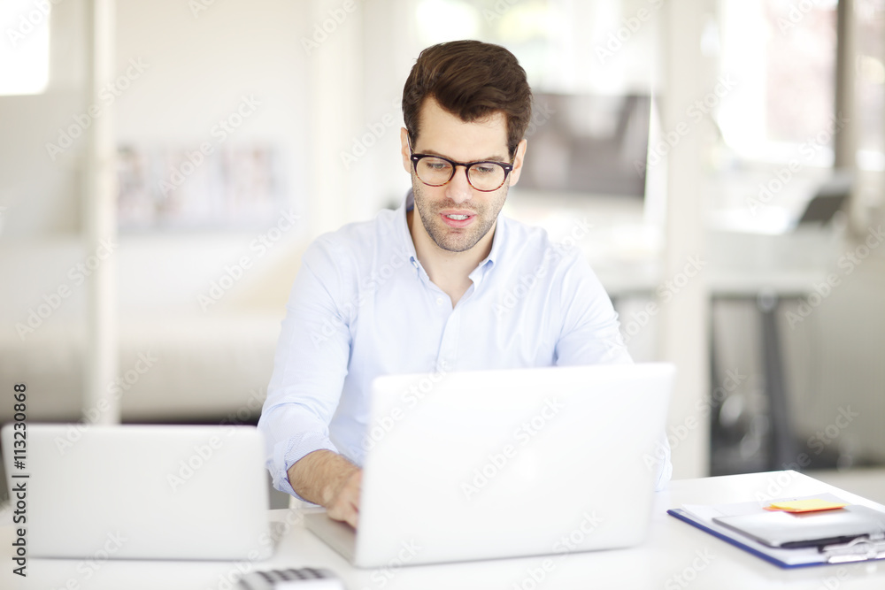 Young professional man at office Young professional man at office