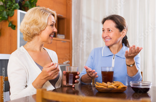 Elderly female having coffee break