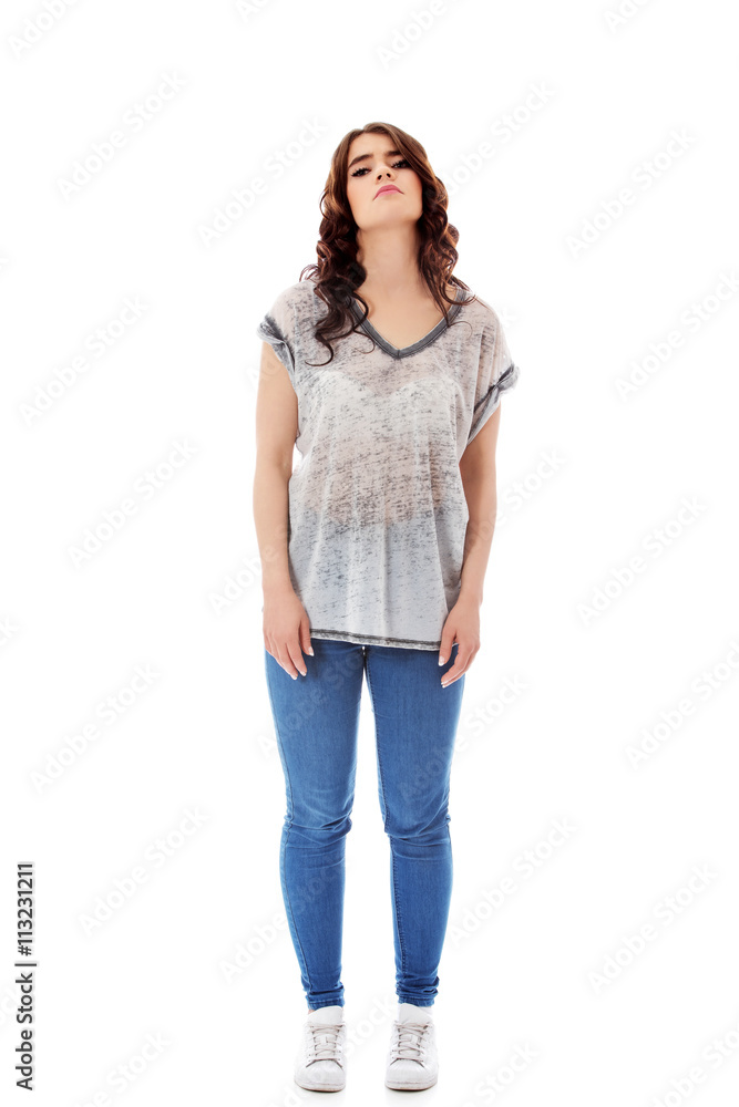 Fototapeta premium Young unhappy woman with long dark hair.