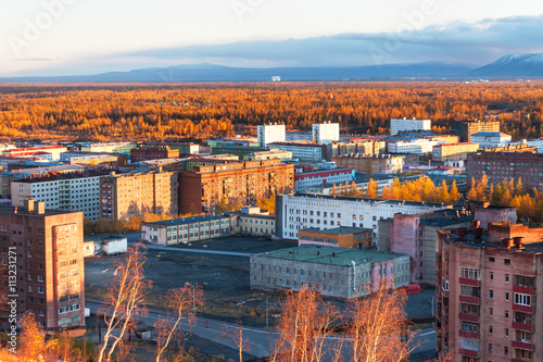 The residential area of the industrial city in the Arctic Circle. Sunset. bad lighting conditions.