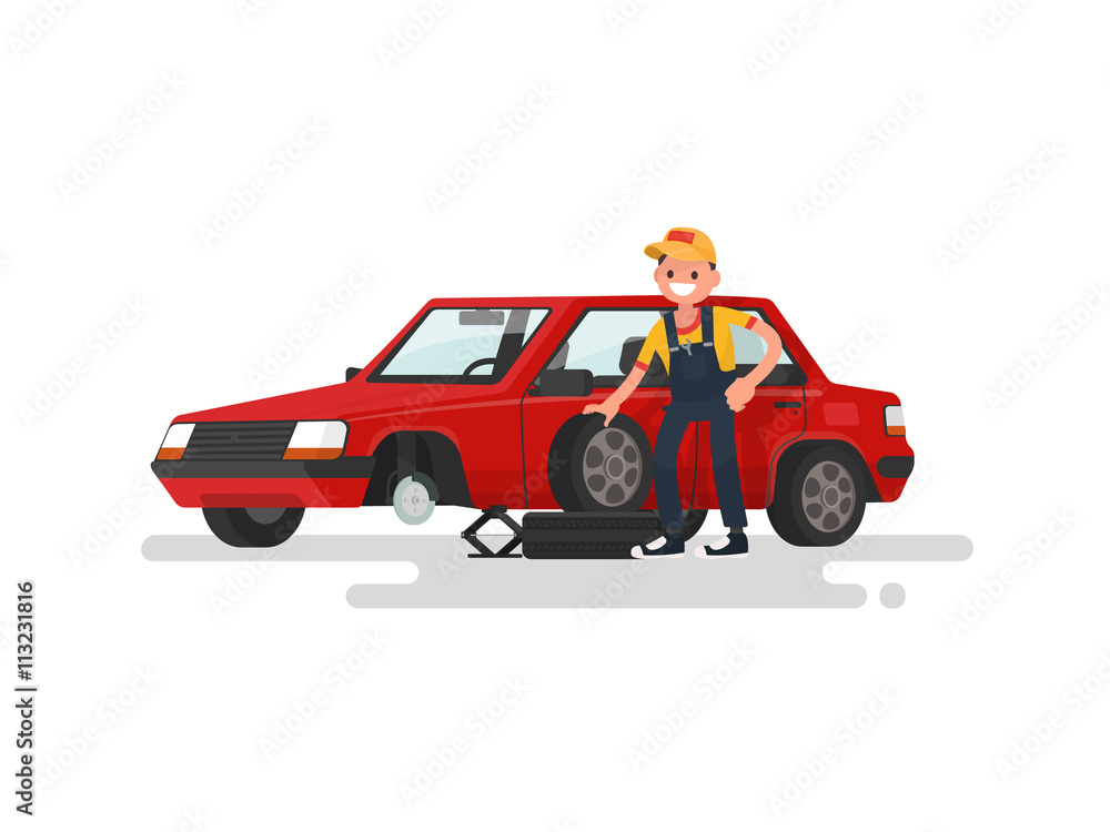 Naklejka premium Tire service. Worker changing a punctured tire a passenger car.