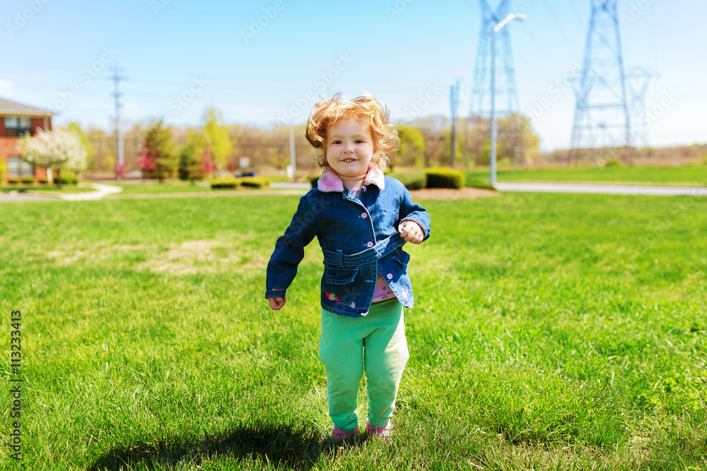 beautiful girl playing in the street in the spring beautiful girl playing in the street in the spring