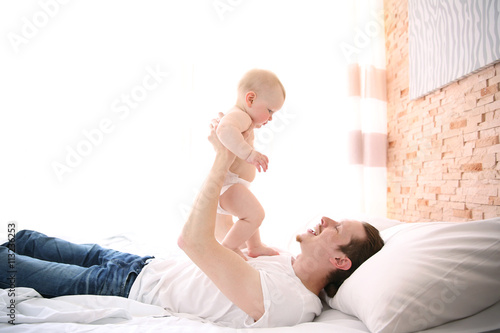 Young father having fun wit...