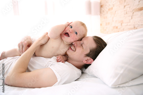 Young father having fun wit...