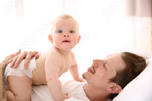 Young father having fun wit...