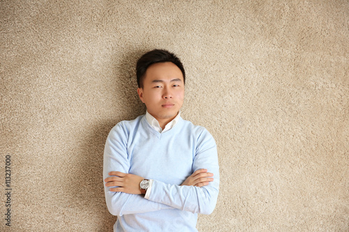 Handsome man lying on floor